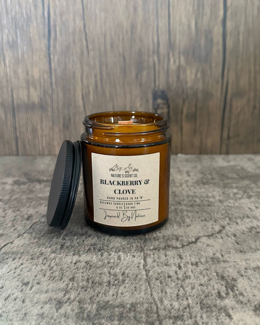 Warm and spicy Blackberry Clove beeswax candle in an amber glass jar, perfect for a cozy & inviting ambiance