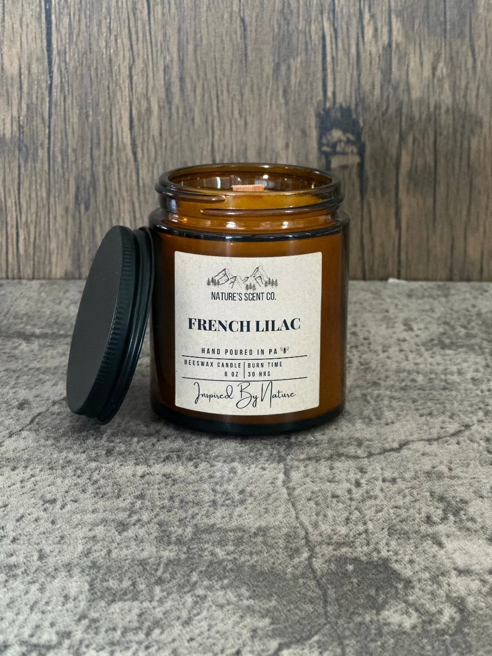 Soft and floral French Lilac beeswax candle in an amber glass jar, perfect for a fresh spring ambience