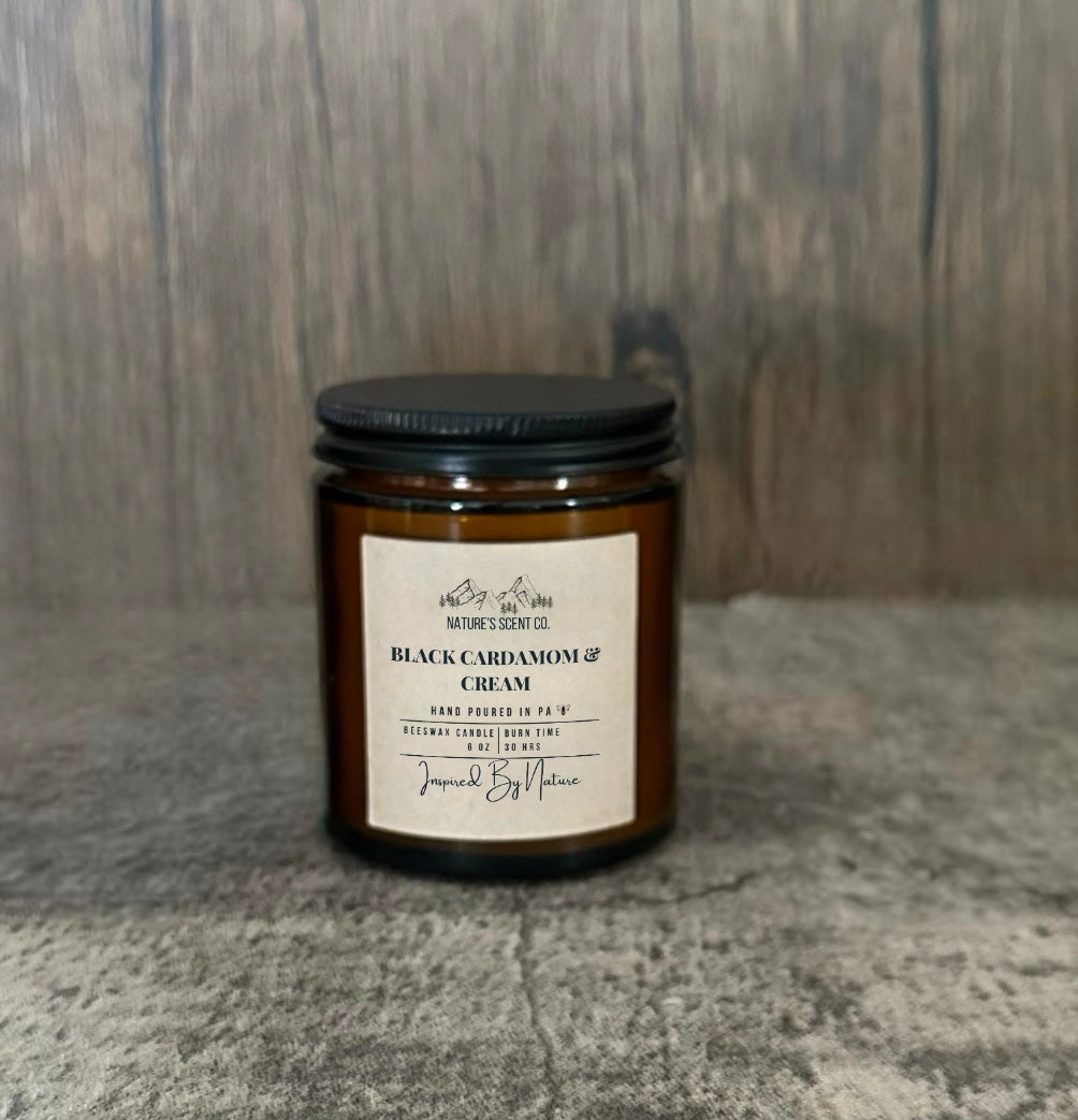 Rich and creamy Black Cardamom and Cream beeswax candle in an amber glass jar, perfect for a cozy and indulgent ambiance