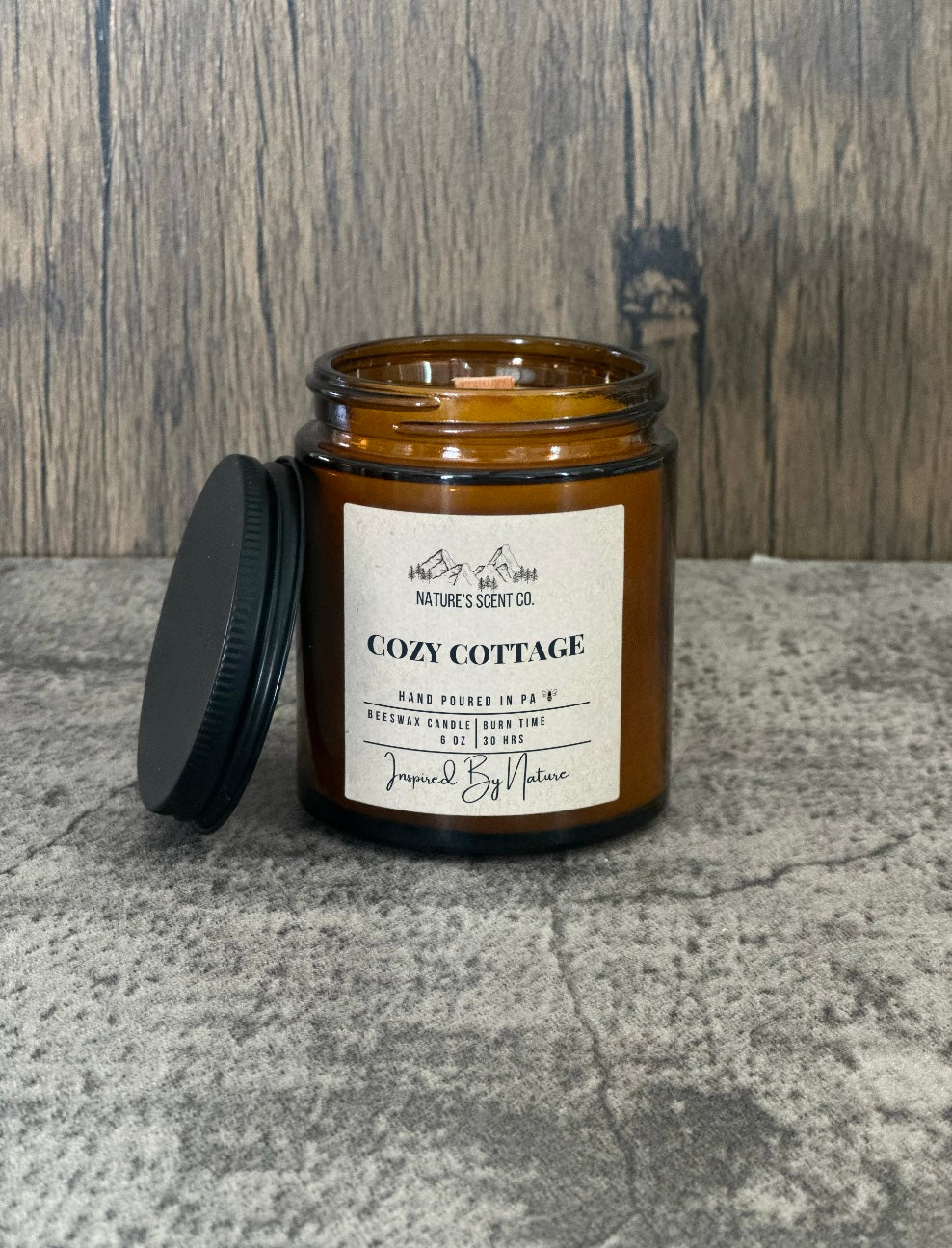 Non-toxic cozy cottage scented candle, made with pure beeswax and plant based essential oil infused fragrance oils in a amber jar